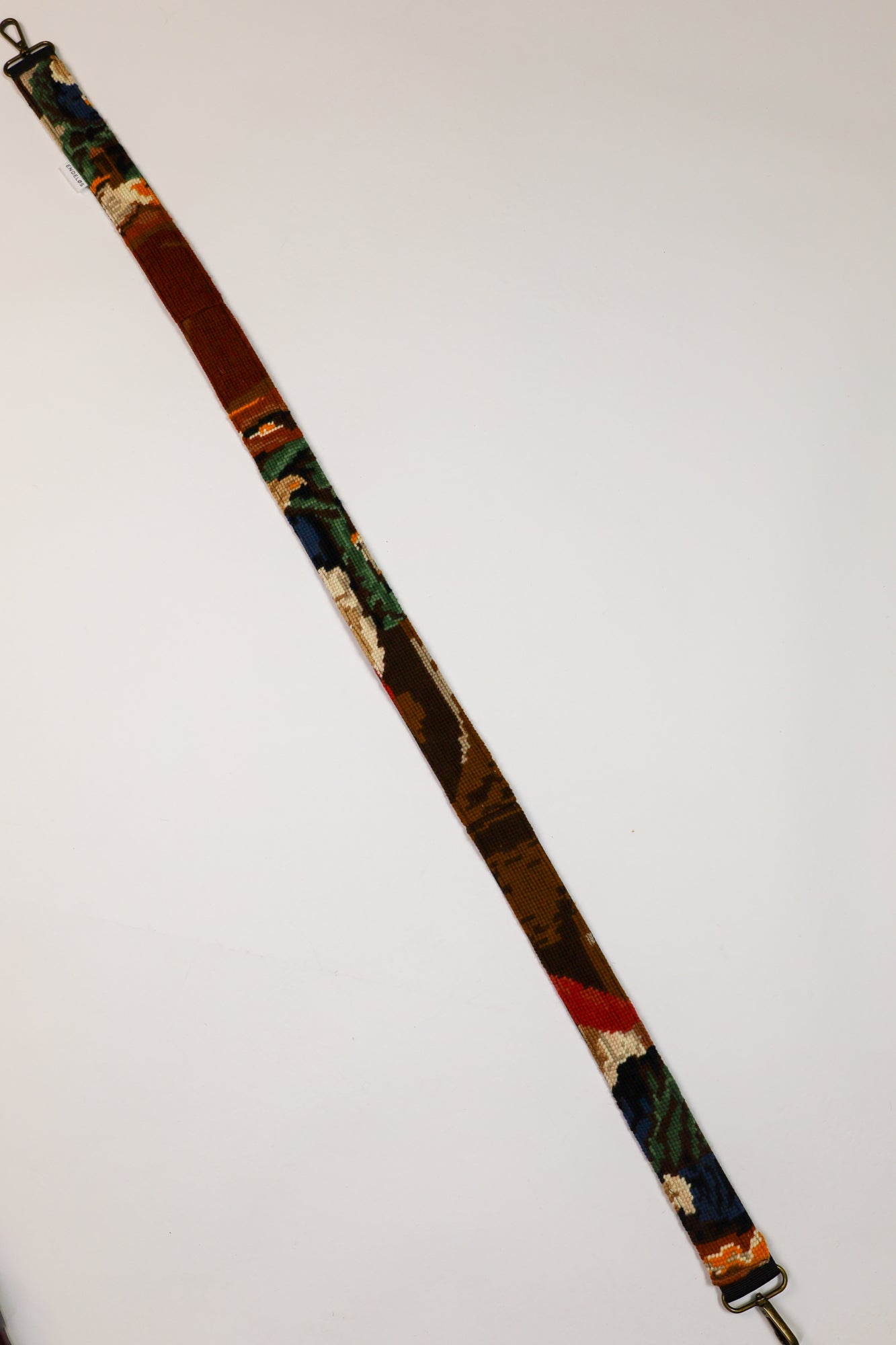 Unique strap featuring an image from The Gold Weigher, a stylish addition to your bag or camera.