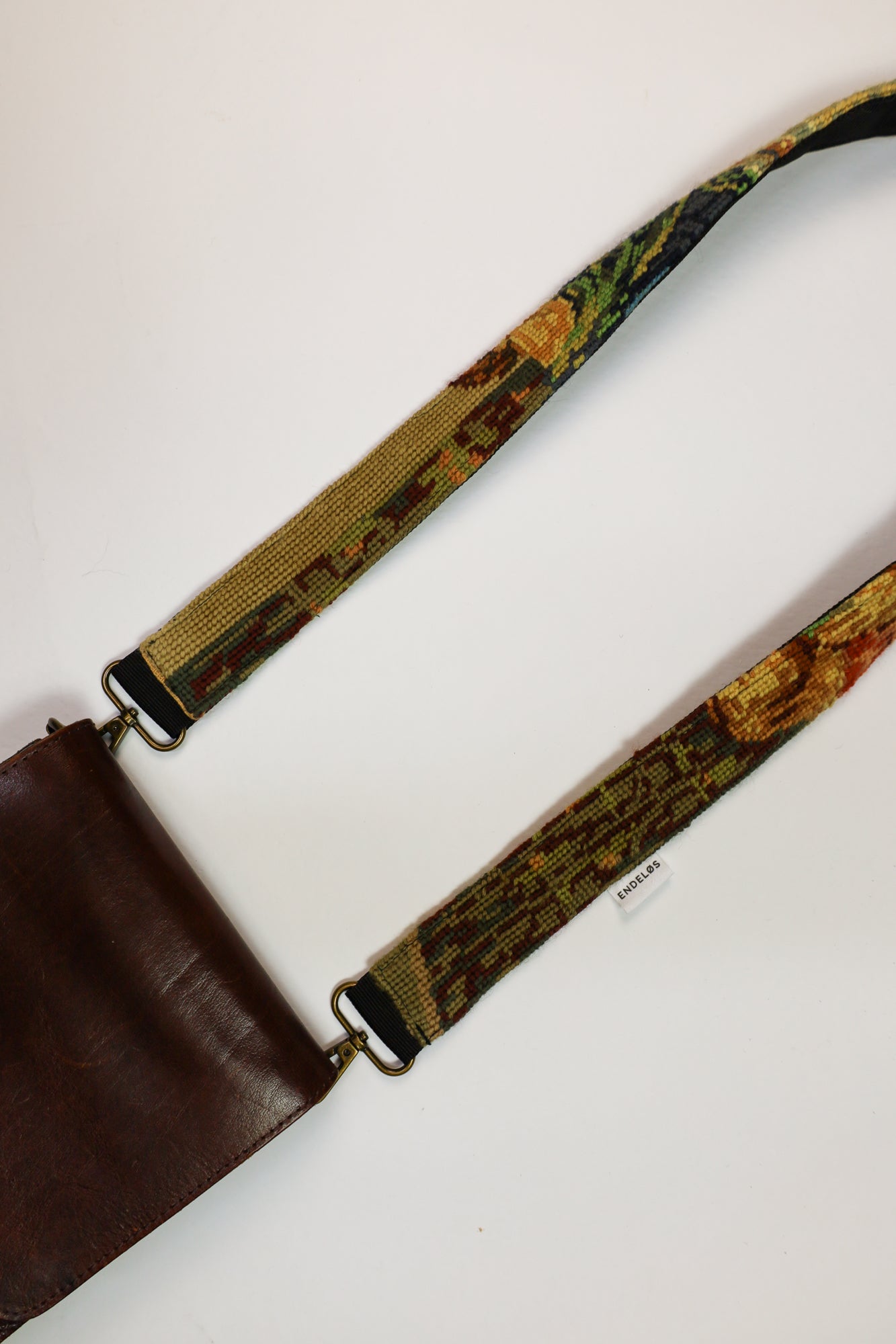 Unieke strap met een kunstzinnige weergave van Het Laatste Avondmaal, ideaal voor het toevoegen van karakter aan je accessoires.
