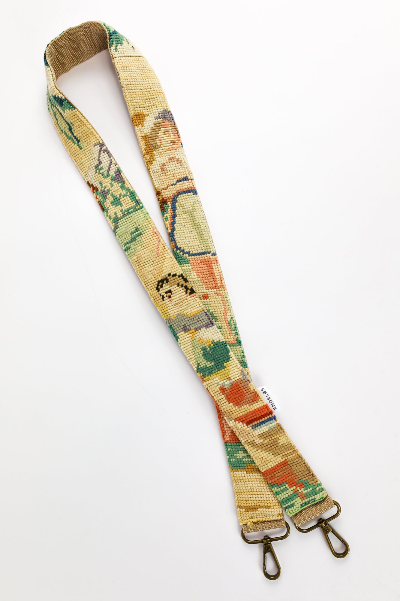 Strap made from embroidered painting with pastel-colored threads, a unique and personal addition to your bag, phone, or camera.