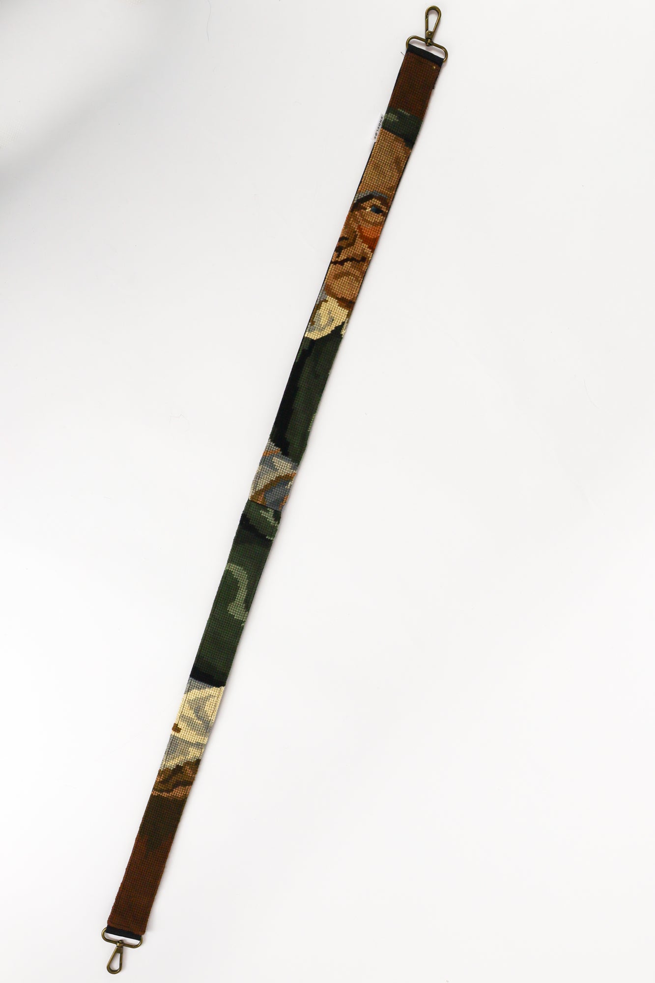Handcrafted strap made from an embroidered painting of a drinking man, with rich dark tones that add character and style to your items.