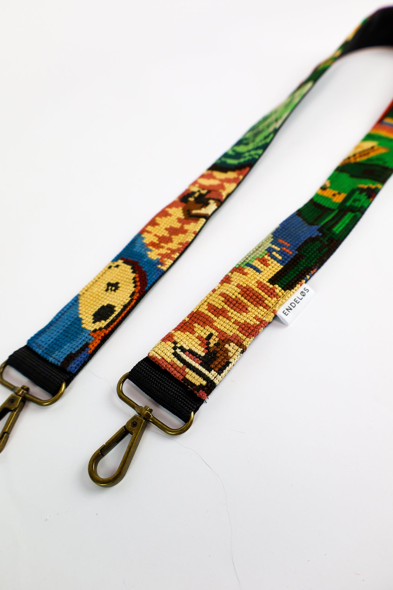 Versatile strap made from a colorful embroidered artwork, offering a stylish and durable way to personalize your bag, phone, or camera with a one-of-a-kind design.