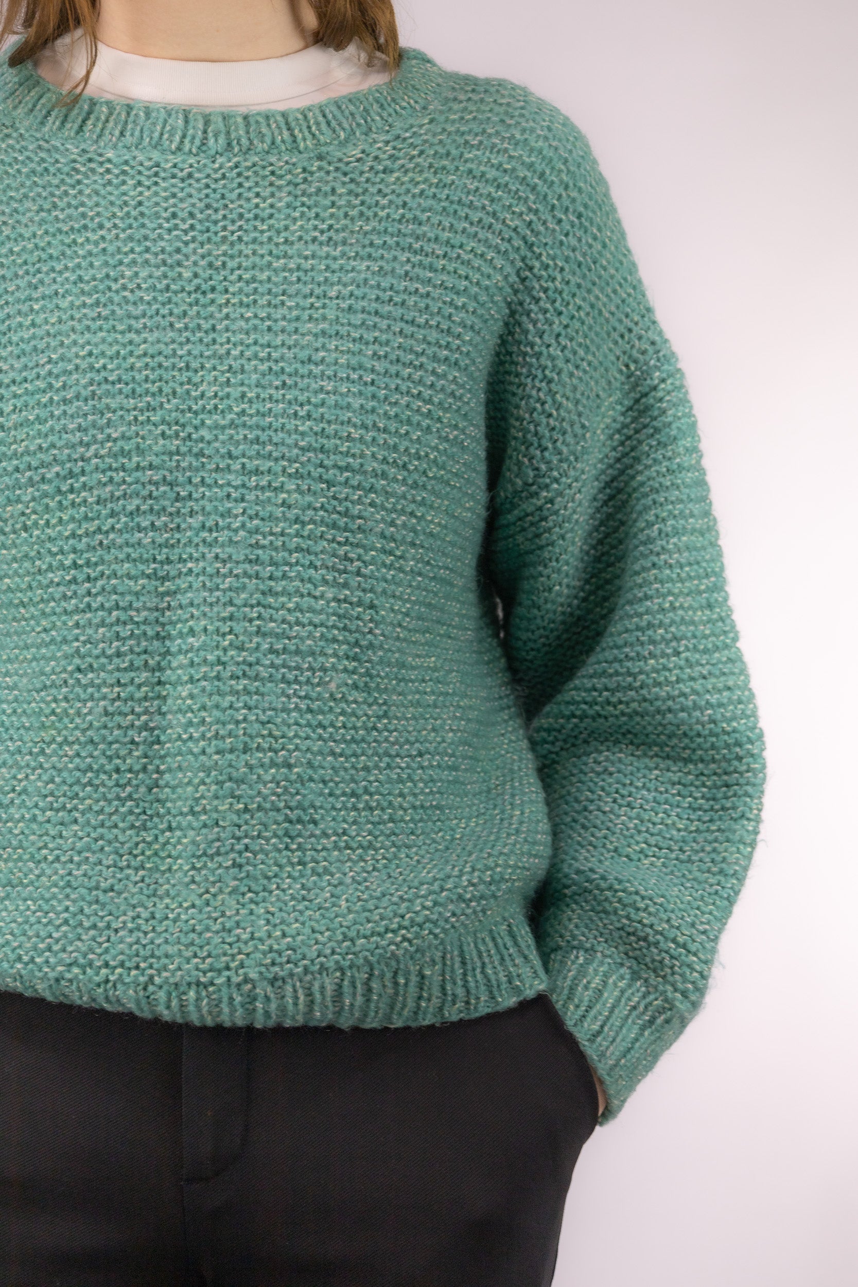 Detail van mintgroene knit structuur van vintage gebreide trui