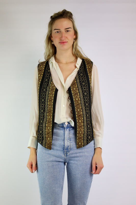 Vintage reversible gilet met effen bruine voorkant en geprint achterpand.