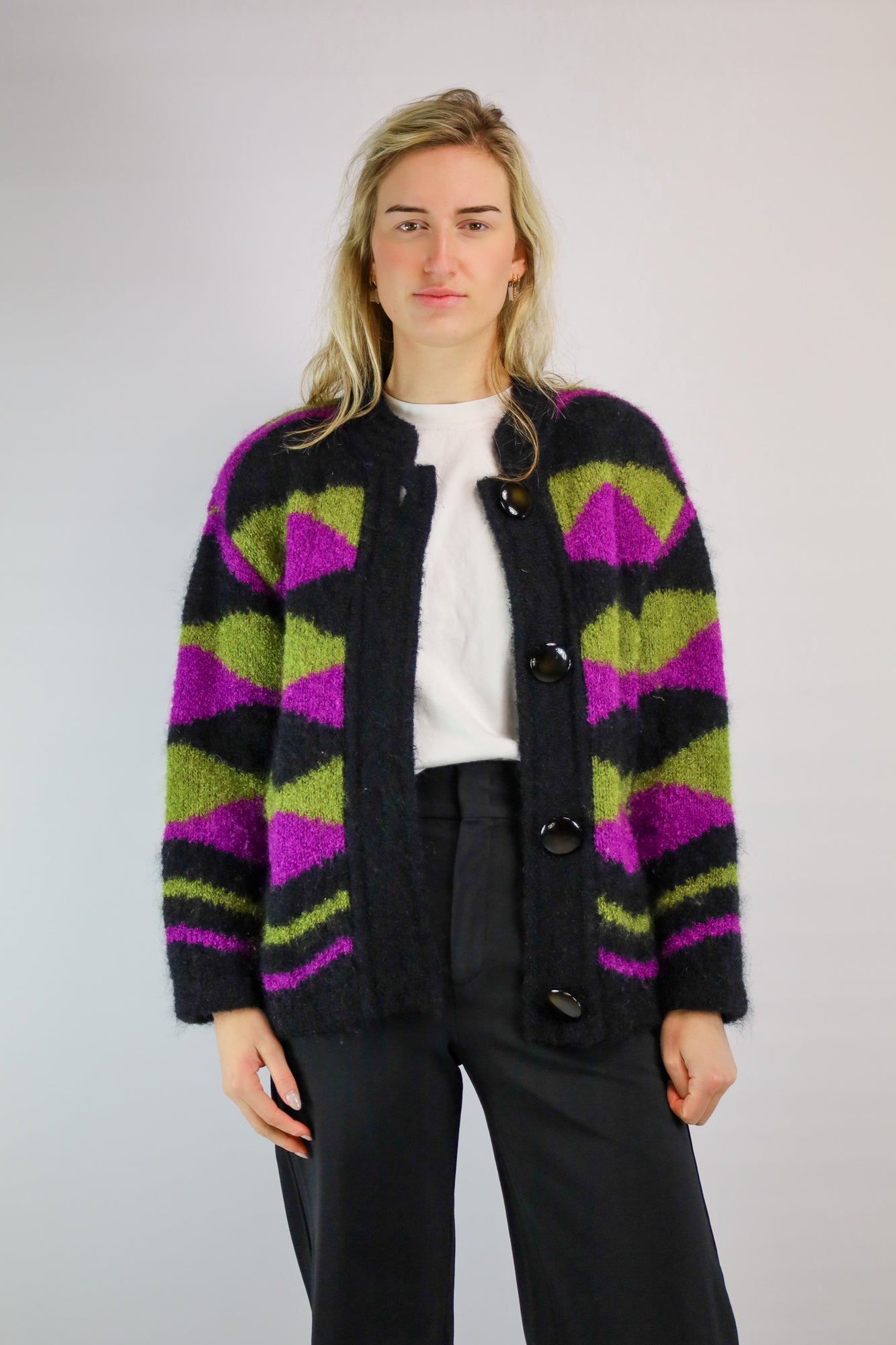 Waanzinnig vintage mohair vest met zwart, roze en groene tinten.