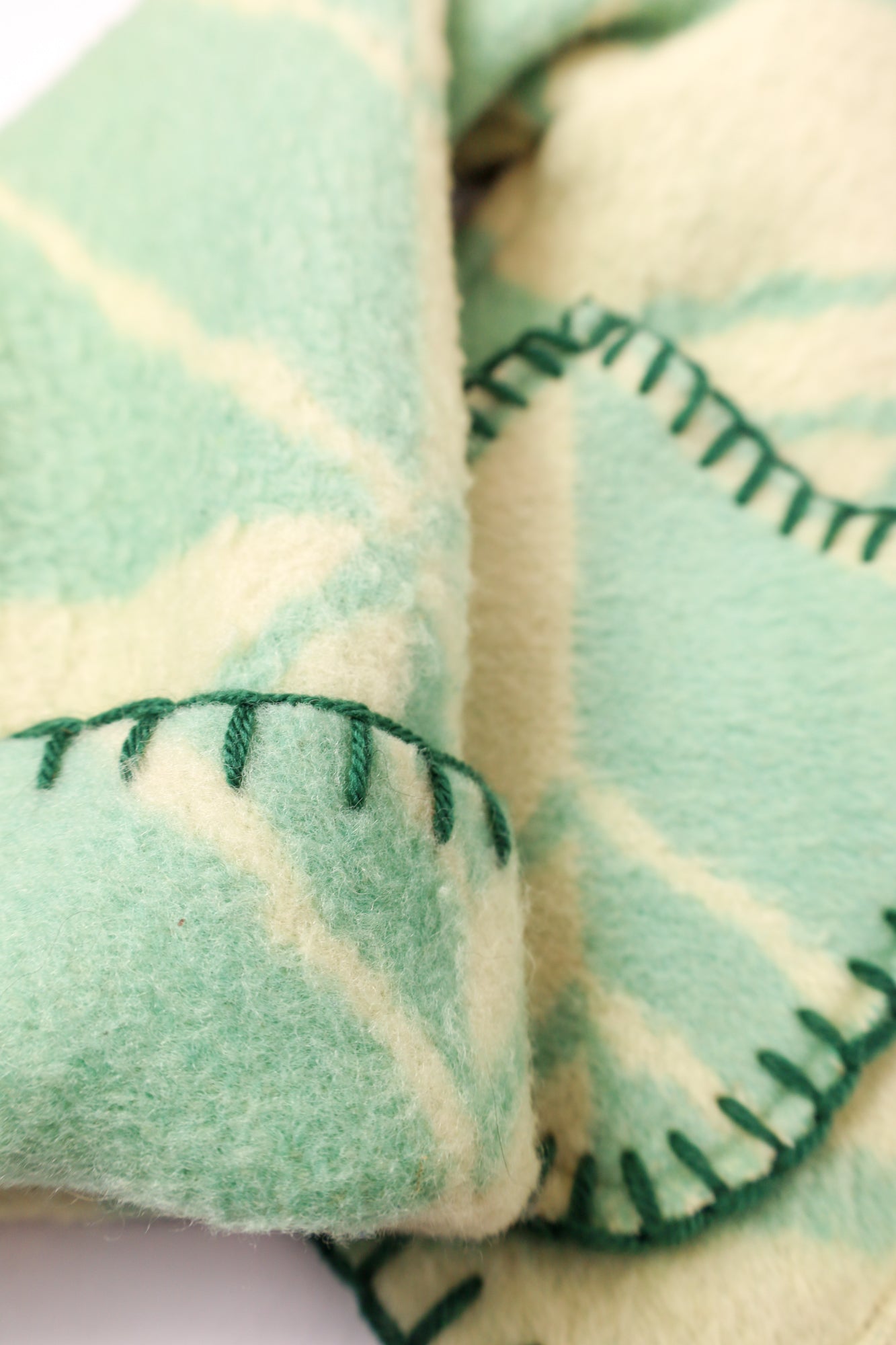 Close-up of the green stitching along the seams, adding a subtle yet cohesive finish.