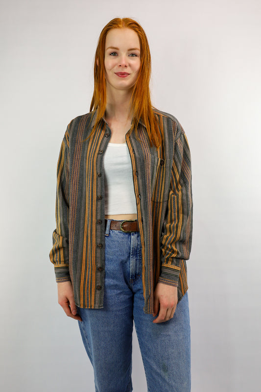 Voorkant van vintage blouse in oranje-bruin met strepen in verschillende diktes