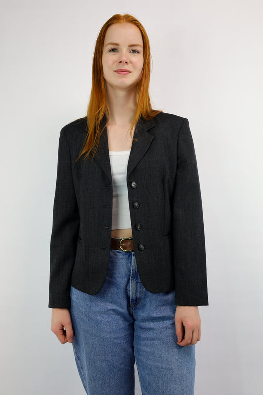 Voorkant van zwart-grijze blazer met visgraatmotief van United Colors of Benetton